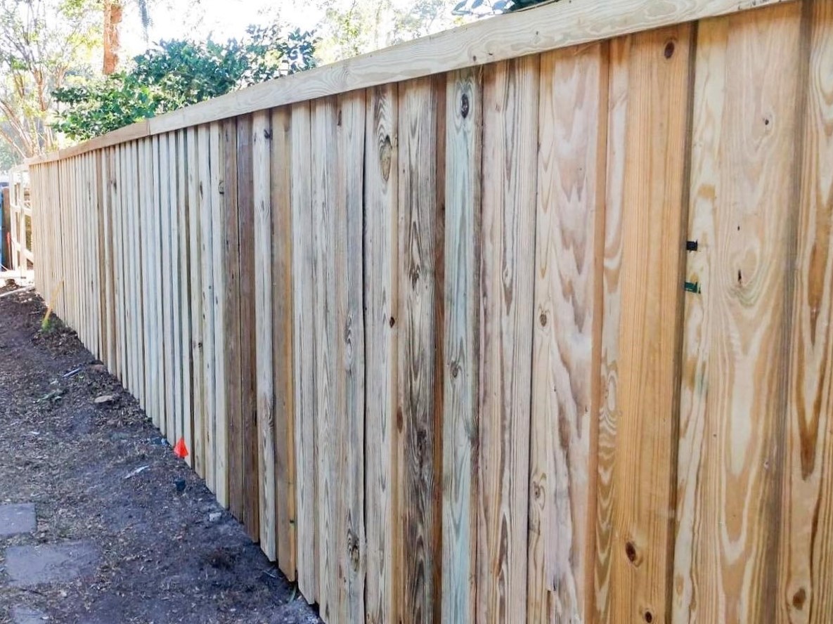 Photo of a tall wood privacy fence