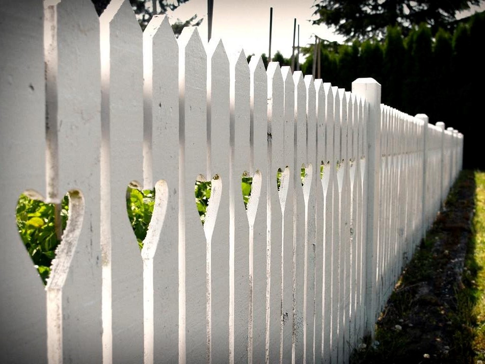 Photo of a white wood picket fence