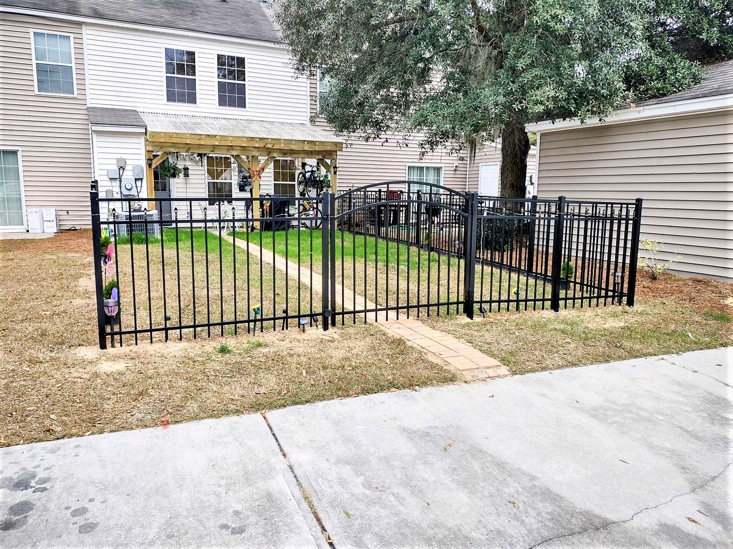 Photo of a black aluminum fenced in yard