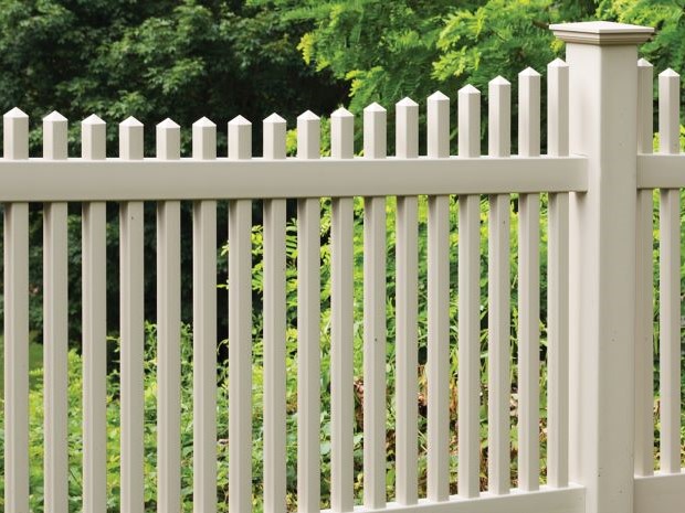 Photo of a tan picket vinyl fence