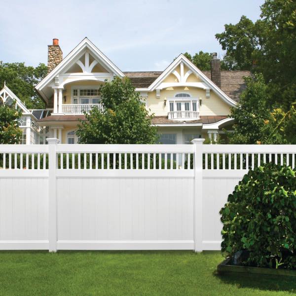 Photo of a white vinyl privacy fence